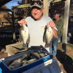 Paul Fisher and wife limiting out on Crappie!